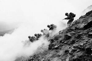 A group of soldiers are climbing up a mountain photo