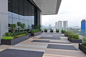 A balcony with planters and a view of the city photo