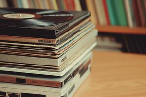A stack of vinyl records on a table photo