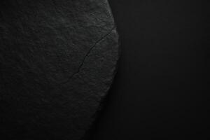 a black rock with a crack in it photo