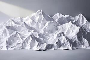 Crumpled paper resembling mountain range in studio setting photo