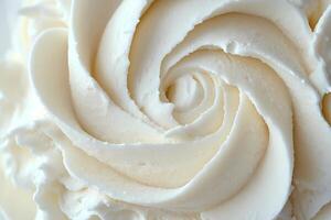 Delicious creamy white buttercream frosting swirls in a perfect spiral shape photo