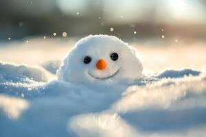 Cheerful snowman head emerging from snow photo