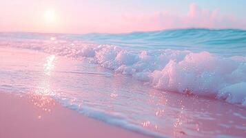 A pink beach with waves and the sun setting photo