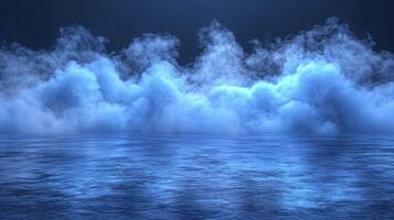 A blue ocean with some clouds in the sky photo