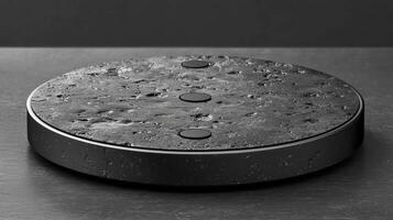 An amazon echo dot with a black surface photo