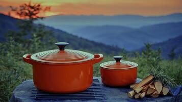 A couple of pots and a grill on a rock photo