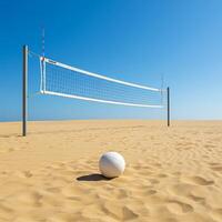 A volleyball net and ball on a sandy beach photo