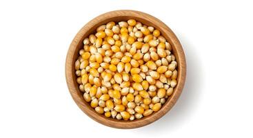 Corn in wooden bowl on white background photo