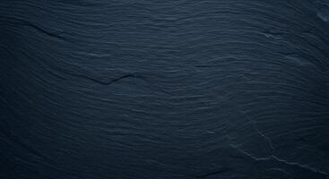 A dark blue background with waves and dark lines photo