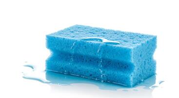 Blue sponge with water on white background photo