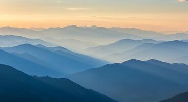 The sun is setting over the mountains in this photo