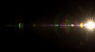 A bright light shining through a dark background photo