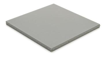 A gray square tile on a white surface photo