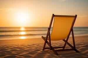 Empty Beach Chair Facing Sunset over the Sea photo