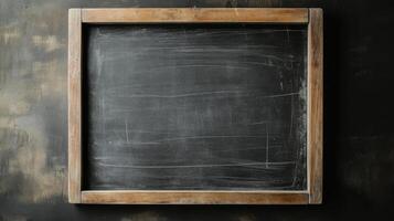 Empty chalkboard ready for lessons in a classroom setting during the day photo