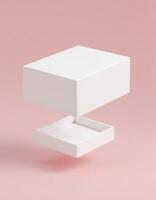 Floating white box parts on pastel pink background photo