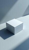 White box on a table with shadow photo