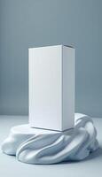 Vertical white product box on soft draped fabric photo
