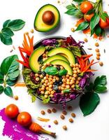 A bowl of vegetables and avocado with colorful leaves photo