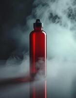 Red plastic water bottle with smoke on a black background photo