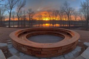Circular wooden seating area with a tranquil sunset view. photo