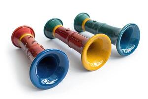 Three colorful musical instrument toys are shown together in a row photo