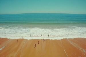 High-angle view of a sandy beach and ocean waves. photo