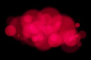 Red bokeh lights on black background vector