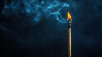 A matchstick with smoke coming out of it photo