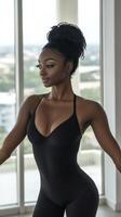 A woman in a black bodysuit posing for a photo