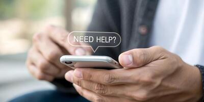 Man using smartphone with need help sign photo