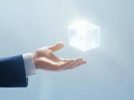 Futuristic business concept with outstretched hand holding glowing data cube for innovative technology design photo
