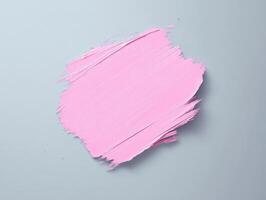 Minimalist art featuring soft pink brushstroke on gray canvas background for modern decor photo