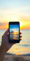 Capturing a vibrant sunset on a modern smartphone at the beach photo