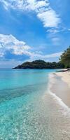 Serene pristine beach with clear turquoise waters and white sand for tranquil escape photo