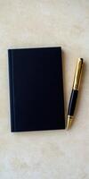 Elegant Father day gift concept with black notebook and pen flat lay in ultra realistic photo