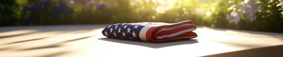Patriotic symbolism with folded American flag in sunlit setting photo