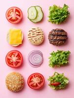 Minimalist flat lay of burger ingredients on pink background for culinary art design photo
