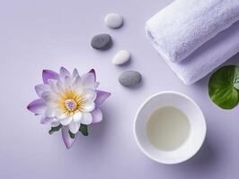 Peaceful spa setting with white ceramic bowl, essential oil, and lotus flower for relaxation and wellness photo