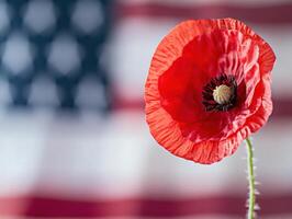 Ultra realistic red poppy with American flag background for memorial or veterans remembrance photo