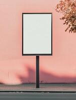 Freestanding vertical billboard mockup against pink wall for advertising design photo