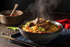 Aromatic steaming bowl of beef fried rice with vegetables served in a dark ceramic bowl on a textured surface photo