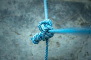 A powerful visual asset for content focused on hiking, climbing, emergency preparedness, or sea travel. The knots detail enhances themes of preparation, strength, and tactical readiness. photo