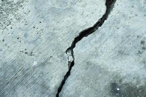 Cracked concrete splitting diagonally photo