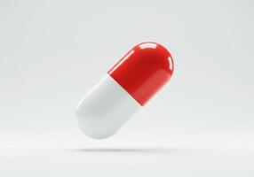 Red and white pill on a white background photo
