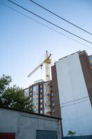 A building with a crane on top of it photo