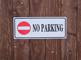 No parking sign on wooden background. photo