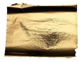 Gold foil with a shiny, metallic texture creates a reflective, luxurious surface. Crumpled and torn photo