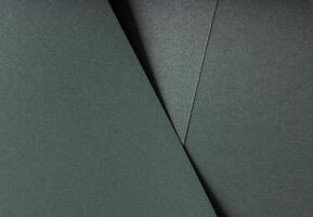 Paper texture with metallic green tone, elegant geometric overlay and glossy surface, layered photo